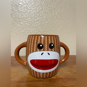 Galarie: Double Handle Monkey Mug.